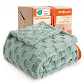 Bedsure Gentlesoft sage green blanket folded on bed for dorm cozy