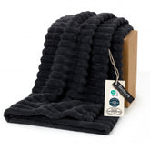 Bedsure GentleSoft Twin XL blanket on the couch with cozy striped fleece texture.