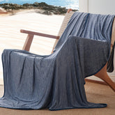 Bedsure navy blue cooling blanket on bed showing cooling comfort for hot sleepers.