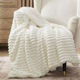 Bedsure sherpa throw blanket in white offers plush warmth for cozy sofa nights.