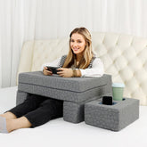 Bespilow extra-large reading pillow with coaster offers comfortable arm support for reading in bed.