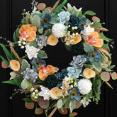 Bibelot 22-inch wreath on front door with blue and white gardenias for curb appeal