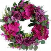 Bibelot artificial purple rose wreath on front door for warm curb appeal