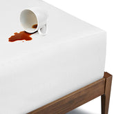 BIOWEAVES organic waterproof mattress protector with breathable top layer for spill defense.