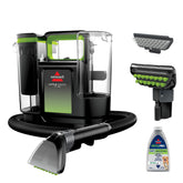 Bissell Little Green Max Pet cleaner tackling a stain on carpet with strong suction.
