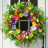 Bloeien 24-inch wreath on front door with meadow blooms to boost curb appeal.