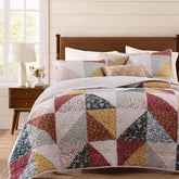 BLOOMHAVEN quilt set queen patchwork burnt orange enhances cozy warmth and timeless style.
