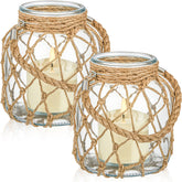 Blushtier nautical candle lantern with rope handle on coffee table creates cozy coastal ambiance.