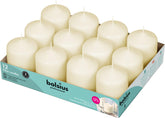 Bolsius Ivory pillar candles on table create an elegant centerpiece with lasting ambiance.