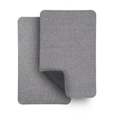 Bosap ultra-thin grey bath mat sits under a door, keeping feet dry.