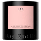 Boy Smells LES candle with peach-citrus floral blend warming your space.