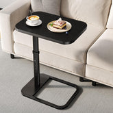 Branwick adjustable-height TV tray beside sofa for dining or laptop work.