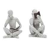 Brighomrom reading-thinker sculpture on a shelf enhances a contemplative reading nook
