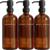 Brighter Barns amber shampoo dispenser set bottles with pumps for organized bathroom storage.