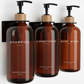 Brighter Barns amber shampoo dispenser wall mount with three chambers for organized shower storage.
