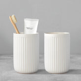 BSDISP white ceramic toothbrush holder with two cups keeps bathroom counter organized.