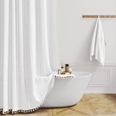 BTTN extra long shower curtain with tassel detail for a lush bathroom aesthetic.