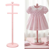 Bucherry pink display stand for baby clothes, keeps garments organized