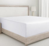 California Design Den fitted sheet on a queen bed with subtle stripe detail.