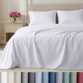California Design Den split-king sheets set on a white bed for adjustable bases