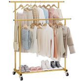 Calmootey double-rod garment rack in gold finish offering ample hanging space for outfits