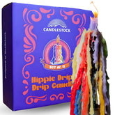 Candlestock Hippie Rainbow drip candles glow around a wine bottle for a dramatic centerpiece.