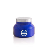Capri Blue Aloha Orchid jar candle in cobalt blue elevates home decor with long-lasting fragrance.