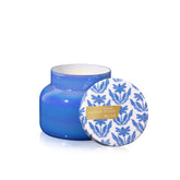 Capri Blue Riviera Sunset jar with iridescent blue glass enhances living room ambiance.