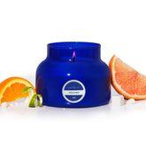 Capri Blue Volcano 19 oz blue jar with long-lasting tropical fragrance for living spaces.