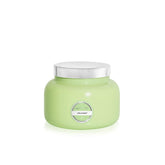 Capri Blue Volcano Iced Matcha Green 19 oz jar glowing with tropical fruit and citrus scent.