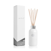 Capri Blue Volcano diffuser bottle shows the white glass container ready for continuous fragrance