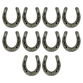 Carvers Olde Iron mini horseshoes on wood surface for crafts and decor.