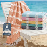 Casa Platino Coastal Carnival beach towel folded, compact for travel and easy packing.