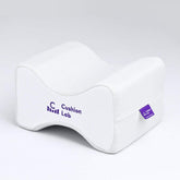 C CUSHION LAB knee pillow between thighs supports hip alignment for side sleeping.