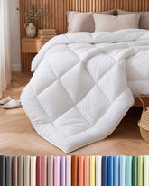 CGK Unlimited Cal King white down-alternative comforter folded, showcasing plush warmth