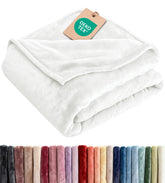 CGK Unlimited ultra-soft fleece blanket on a queen bed for year-round comfort