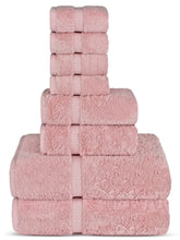 Chakir Turkish Linens pink bath towels stacked, spa-like softness and absorbent feel.