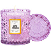 Chloefu LAN Lilac Blossoms Candle in a purple jar creates warm ambience.