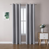 ChrisDowa blackout curtains panel with silver grommets blocks daylight and adds privacy.