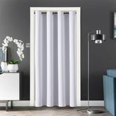 ChrisDowa blackout door curtain with grommets blocks light and enhances doorway privacy.