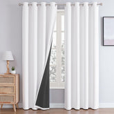ChrisDowa white blackout curtains with grommet-top design block light for restful sleep.