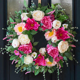 CHvista 24-inch spring wreath with peonies and magnolias enhances curb appeal.