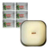 Coleman pine citronella candle with open tin, highlighting pine scent for outdoor evenings.