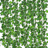 Comtelek fake ivy garland 7ft on a wall enhances natural ambiance.