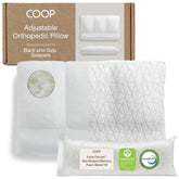 Coop Home Goods adjustable orthopedic pillow front view on bed, showcasing customizable support for all sleep positions