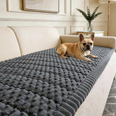 CoSofSLIP couch cover on a dog-friendly grey sofa protects furniture and stays securely in place