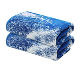 Cotton Craft Summer Wave XXL towel laid flat for two to lounge comfortably.