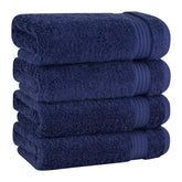Cotton Paradise hand towels folded to show the 4-piece navy blue set's plush softness