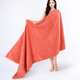 Cotton Paradise soft-absorbent Turkish towel in coral, ideal for quick drying after showers.