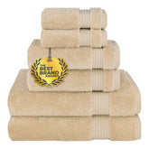 Cotton Paradise beige bath towels shown in a home spa setup.